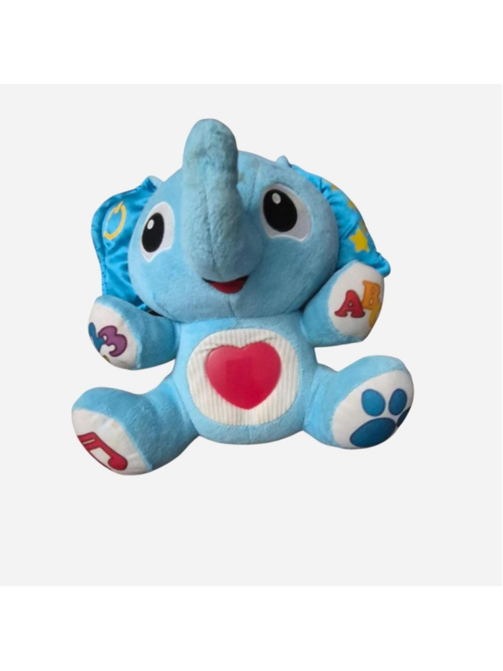 Blue elephant plush toy with red heart and colorful letters and symbols on its l